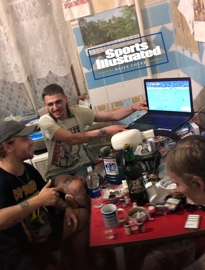 Sports Illustrated asked Ukraine fans to send in pictures of themselves watching Wednesday's game. Mytsuk (seated, in black shirt) gathered at home with friends.